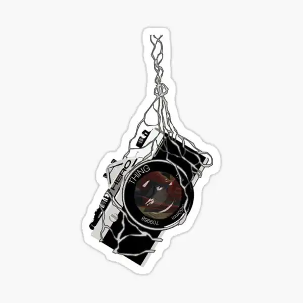 Hanging camera aesthetic sticker featuring a compact black and white camera suspended by tangled cords.